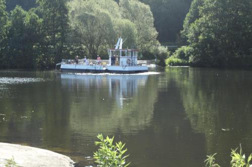 a boat in the water with people on it at Grüner Blick in Witten