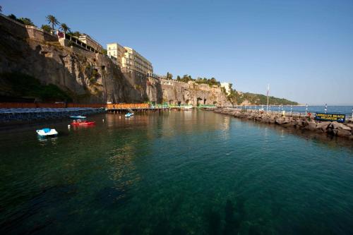 a large body of water with boats in it at Hotel Continental in Sorrento