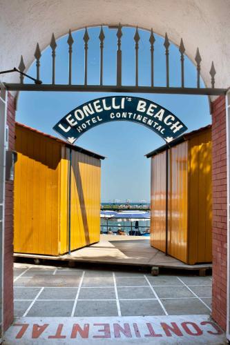 an entrance to a building with a yellow gate at Hotel Continental in Sorrento