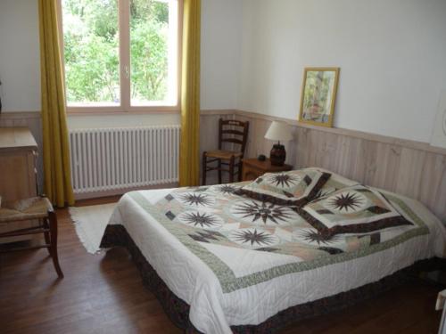 A bed or beds in a room at Gîte "Chante' Relle"