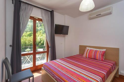 Ένα ή περισσότερα κρεβάτια σε δωμάτιο στο A Casa di Mila