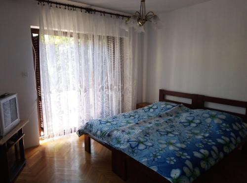 Postel nebo postele na pokoji v ubytování Apartments Placovici