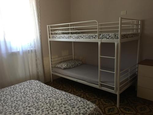 Postel nebo postele na pokoji v ubytování Grano Arso Appartamento Turistico