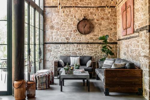 a living room with a couch and a table at Casa Sur Antalya in Antalya