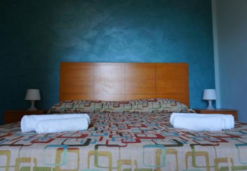 Letto o letti in una camera di B&B Villa del Sole