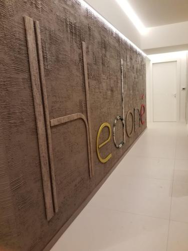 a wall with the word cocaine painted on it in a room at Hedoné Design Experience B&B in Agrigento