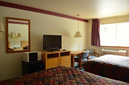Postel nebo postele na pokoji v ubytování Bellingham Lodge
