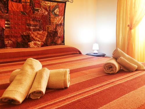 a bedroom with a bed with two towels on it at Casa di Jacopo in Lipari