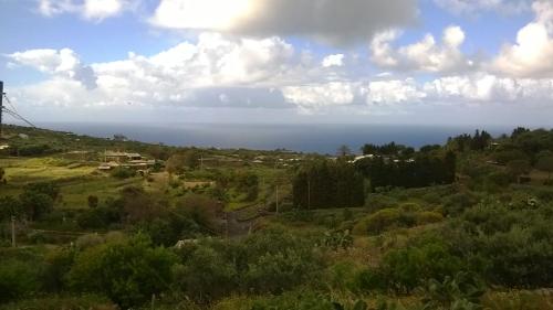 a view of the ocean from a hill at L'Oasi di Recale in Scauri