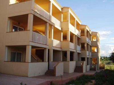 a large apartment building with balconies on the side of it at Marina 1 in Es Pujols