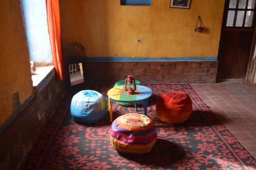 a room with a table and balls on the floor at Riad Hotel Les Flamants in Merzouga