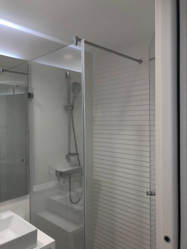 a bathroom with a shower with a glass door at Bel Etage Luxury Rooms in Split