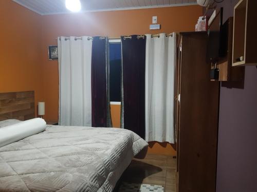 Katil atau katil-katil dalam bilik di Pousada Kolonisten Haus