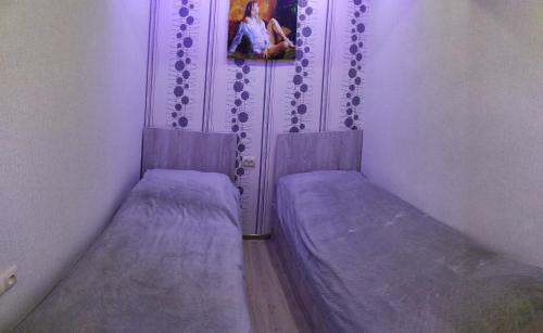 two beds in a corner of a room at Apartment in Sevan