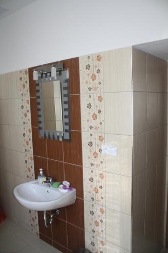 a bathroom with a sink and a mirror at Apartmán v Kašperských Horách in Kašperské Hory