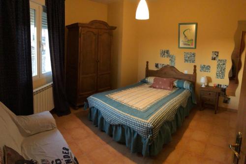 Ένα ή περισσότερα κρεβάτια σε δωμάτιο στο Casas Encinares