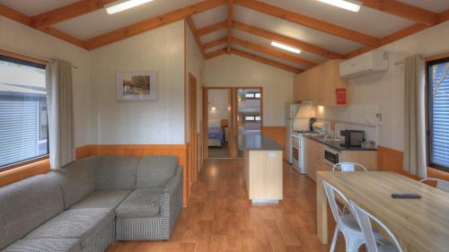 a living room filled with furniture and a window at Yea Riverside Caravan Park in Yea