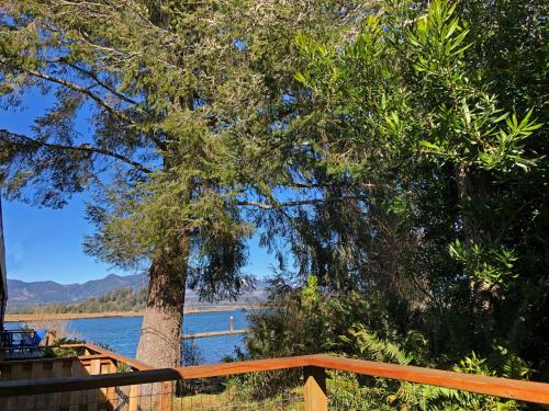 a view of a lake from a wooden deck at Wheeler on the Bay Lodge and Marina in Wheeler