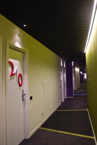 a hallway of an office with a door with a percent sign at President Hotel Palermo in Palermo