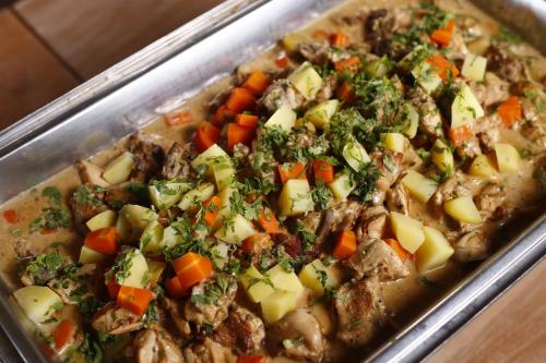 a casserole dish of food with meat and vegetables at Sutera at Mantanani Island Resort & Spa in Mantanani Island 