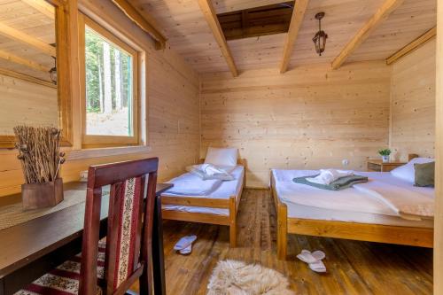 Postel nebo postele na pokoji v ubytování JELA NATURAL RESORT