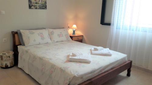 Кровать или кровати в номере Giannos Apartments