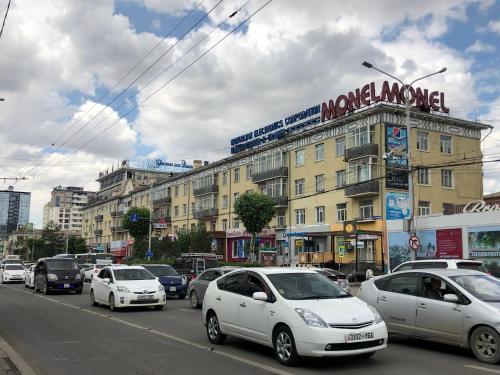 a busy city street filled with lots of cars at Brilliant Location in Ulaanbaatar