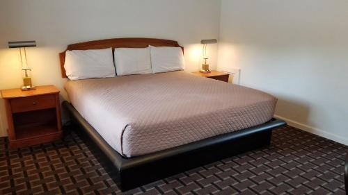 Ένα ή περισσότερα κρεβάτια σε δωμάτιο στο Budget Inn Breezewood