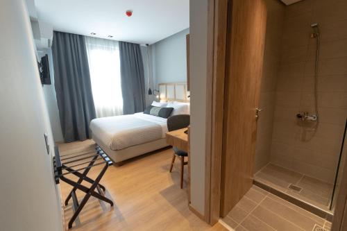 Voodi või voodid majutusasutuse Grand Port Suites toas