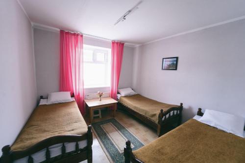 Postel nebo postele na pokoji v ubytování Town Yard Hostel