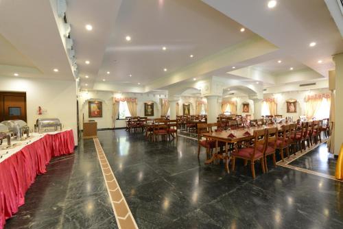 a large banquet hall with tables and chairs at Heritage Resort Bikaner in Bikaner