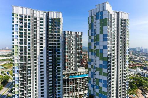 an aerial view of two tall buildings in a city at HostaHome Suites at I-City, Central Mall in Shah Alam