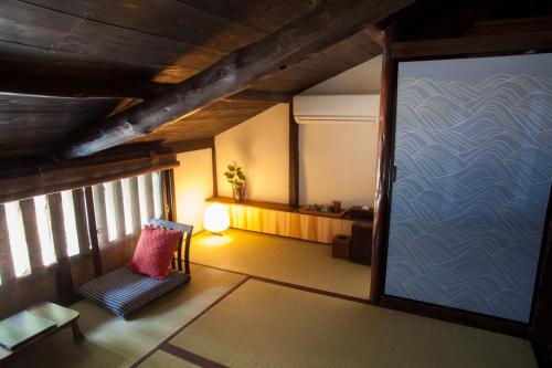 Postel nebo postele na pokoji v ubytování Bed & Breakfast Tsukiya