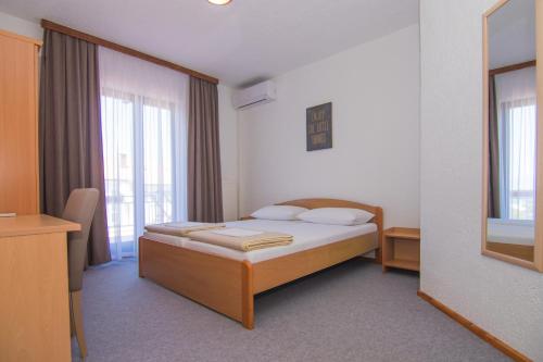 Postel nebo postele na pokoji v ubytování Villa Rustika