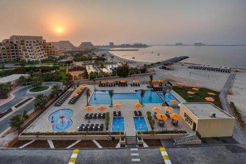a large building with a lot of windows on top of it at City Stay Beach Hotel Apartments - Marjan Island in Ras al Khaimah