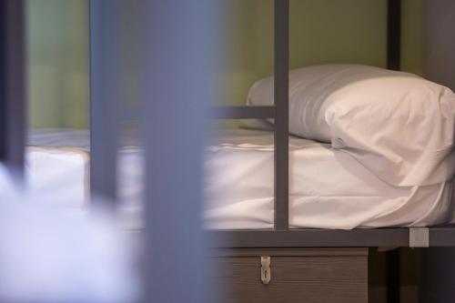 Ένα ή περισσότερα κρεβάτια σε δωμάτιο στο Hostel La Pedriza