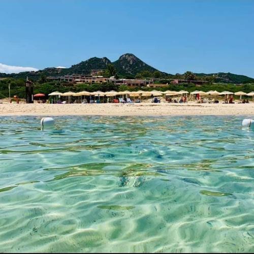 a view of a beach with umbrellas and the water at Free Beach Holiday Home in Monte Nai