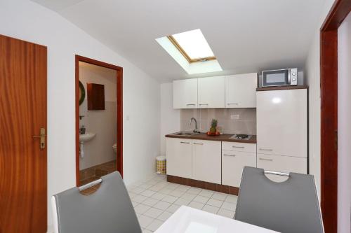Kuchyň nebo kuchyňský kout v ubytování Apartments Golub