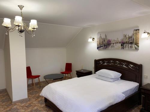 Ένα ή περισσότερα κρεβάτια σε δωμάτιο στο Restoran-hotel Stariy Melnik