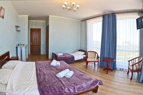 Postel nebo postele na pokoji v ubytování Hotel Golden Beach