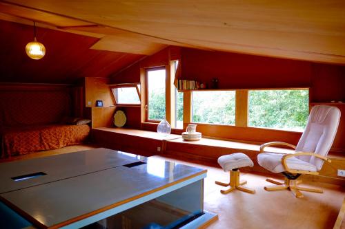 a room with a bed and a desk and a chair at Chambres d'hôtes des Forges in Cellefrouin