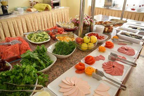 a table with many different types of food on it at Belcehan Hotel in Oludeniz