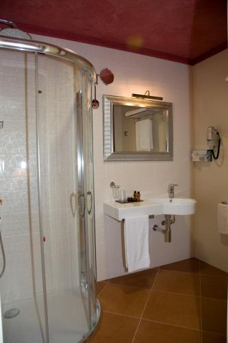 a bathroom with a shower and a sink at Artemis Hotel in Cefalù