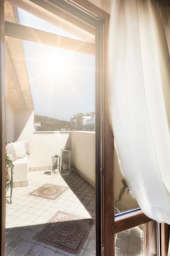 an open door to a balcony with a view at Palazzo Eugenia Suites in Vasto