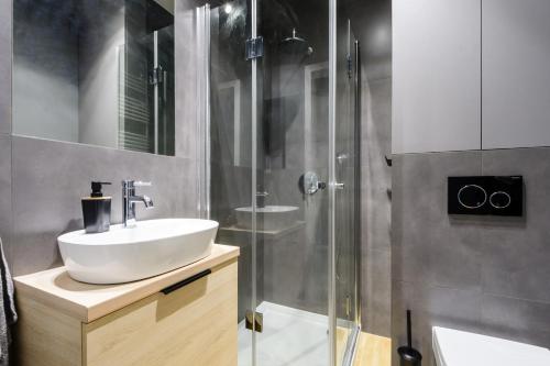 Ванная комната в Aparthotel Pawia Deluxe