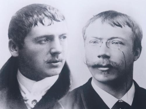 a black and white photo of two men in suits at Prinsgården B&B rum stugor in Mora