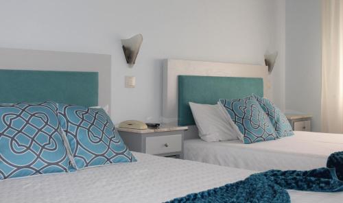 Ένα ή περισσότερα κρεβάτια σε δωμάτιο στο Residencial Clássico