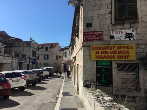 a street with cars parked on the side of a building at Studio Milla in Split