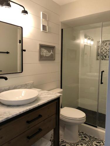 a bathroom with a sink and a toilet and a shower at Regency Towers - beachfront condo in Panama City Beach