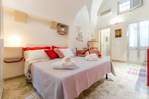 Postel nebo postele na pokoji v ubytování Palazzo Refolo